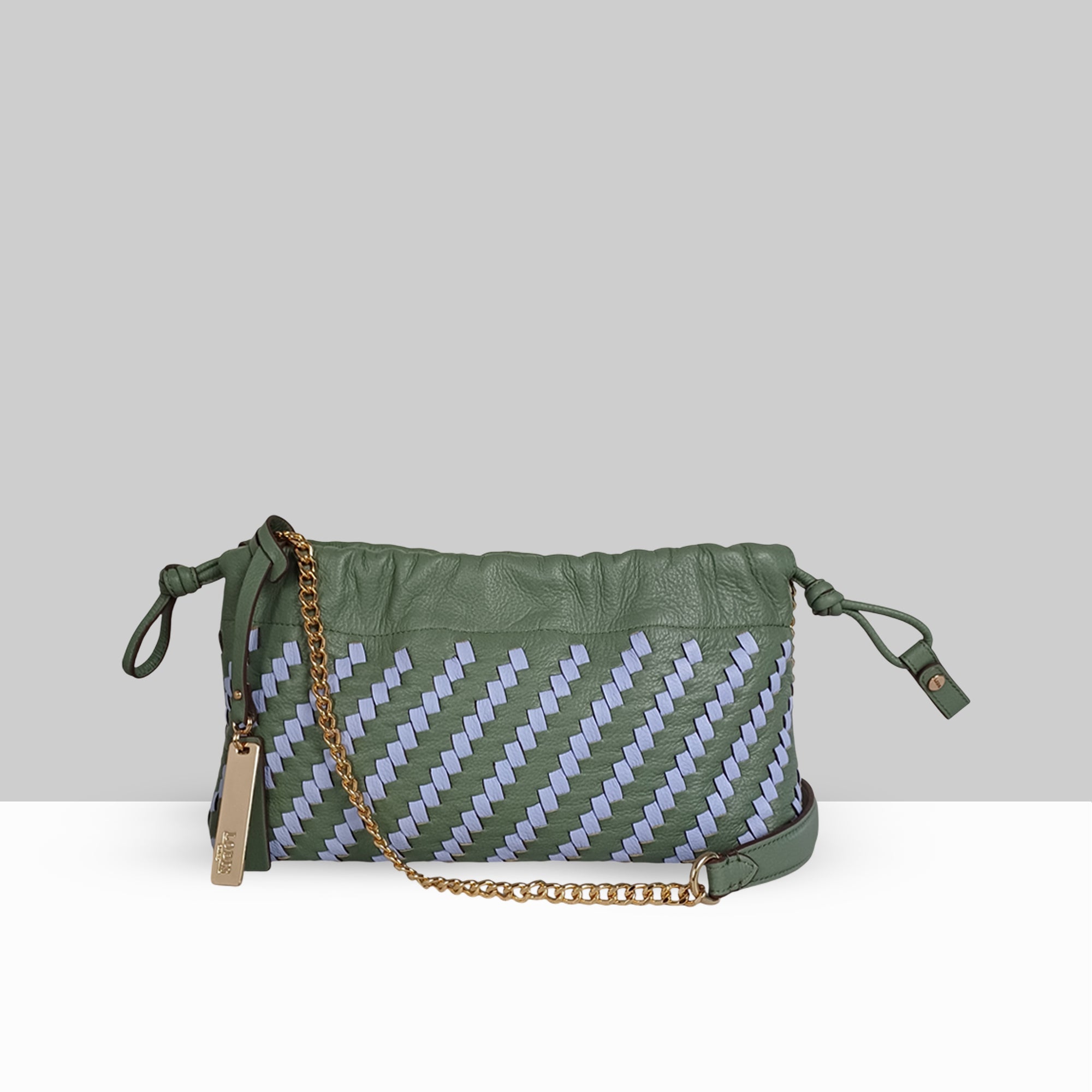 Lodis Solstice Pouch in Sage Green – Front View, Two-Tone Sage and Lavender Interlaced Leather Weave with Drawstring Closure and Gold-Tone Chain Strap | Lodis 1965