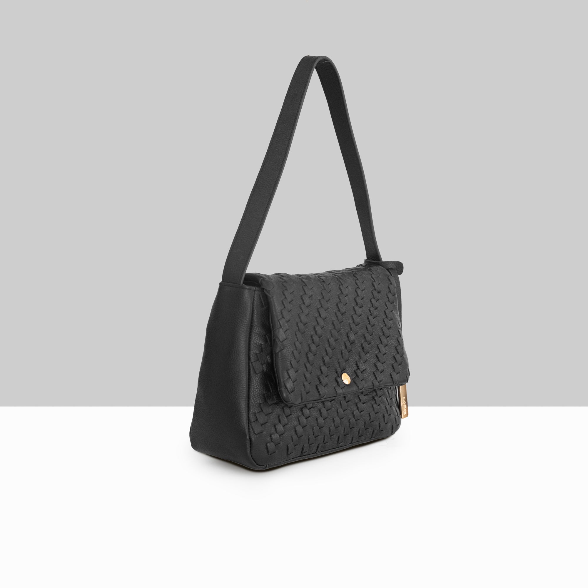 Lodis Solstice Shoulder Bag in Black – Side Profile View, Woven Pebbled Leather with Flap Closure and Gold-Tone Snap Detail | Lodis 1965