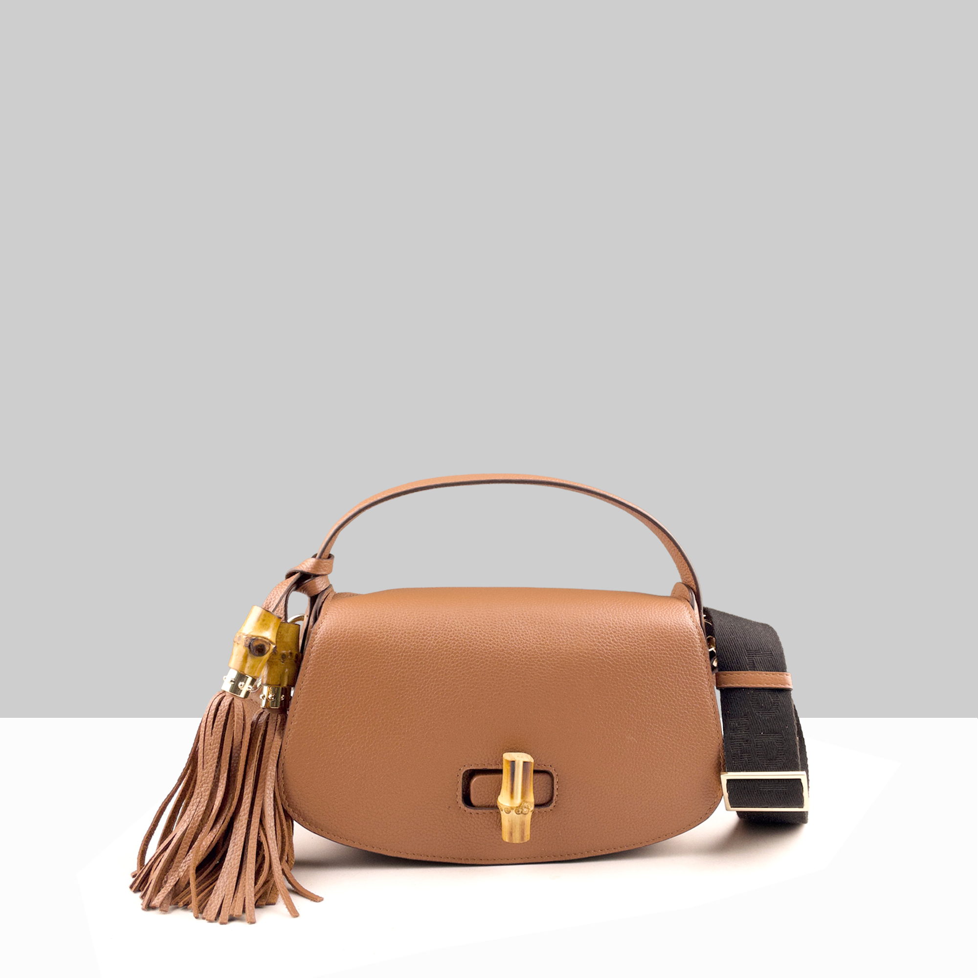 Lodis Sondra Top Handle Crossbody Bag in Chestnut – Front View, Drum Dyed Pebbled Leather with Gold-Tone Bamboo Turn-Lock, Double Tassel, and Woven Strap | Lodis 1965