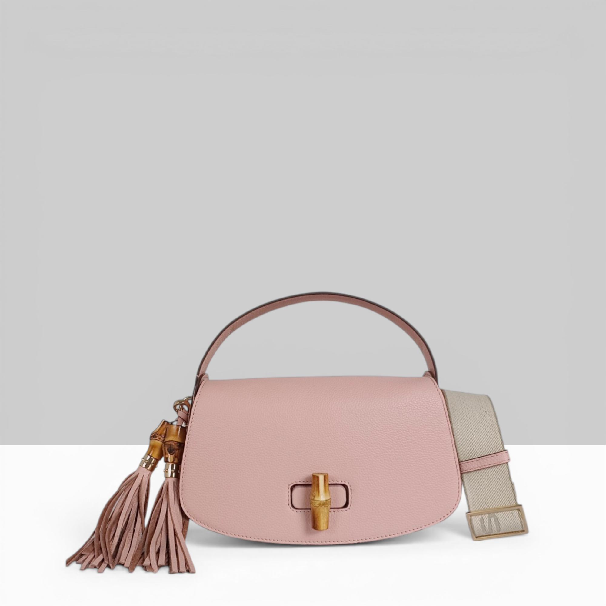 Lodis Sondra Top Handle Crossbody Bag in Dusty Rose – Front View, Drum Dyed Pebbled Leather with Bamboo Turn-Lock, Double Tassel, and Woven Strap | Lodis 1965
