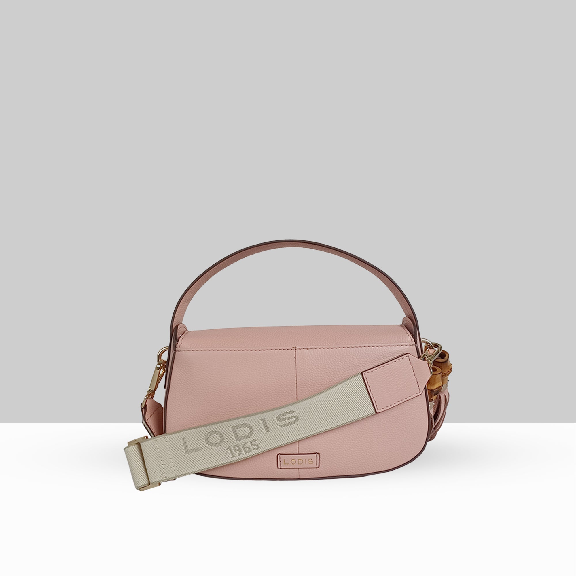 Lodis Sondra Top Handle Crossbody in Dusty Rose – Side View Highlighting Lodis 1965 Branded Woven Strap and Gold-Tone Bamboo Hardware Detail | Lodis 1965