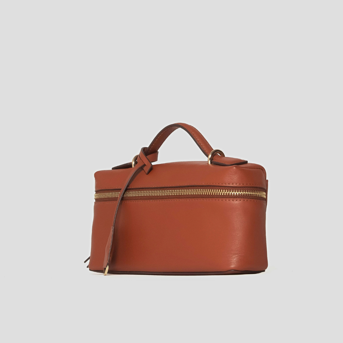 Lodis Stratos Texas Crossbody in Rust - Angled View Showing Structured Box Shape, Knotted Top Handle and Gold-Tone Zip | Lodis 1965