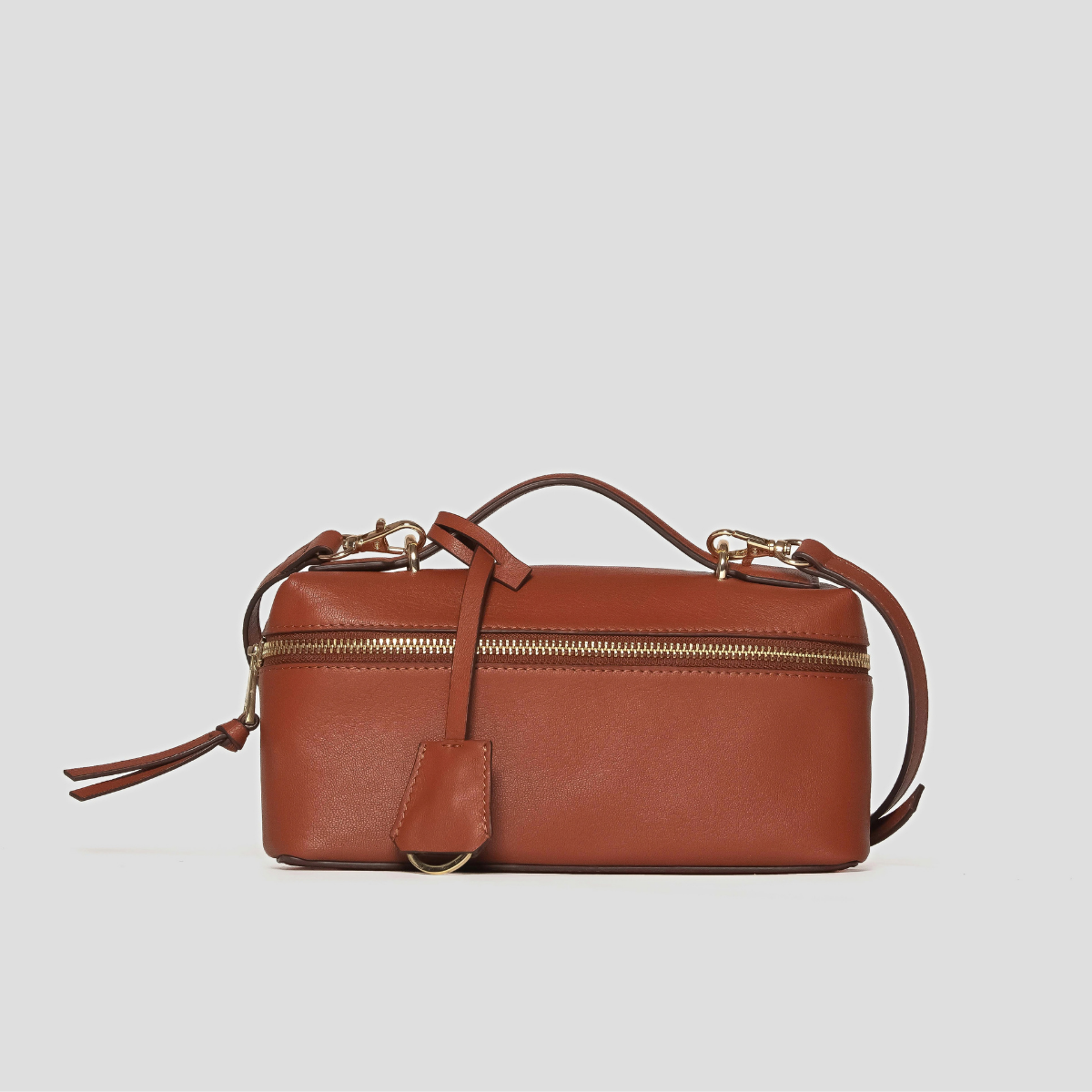 Lodis Stratos Texas Crossbody in Rust - Three-Quarter View, Rust Brown Texas Leather Vanity-Style Crossbody with Top Handle, Crossbody Strap, Leather Hang Tag and Gold-Tone Hardware | Lodis 1965