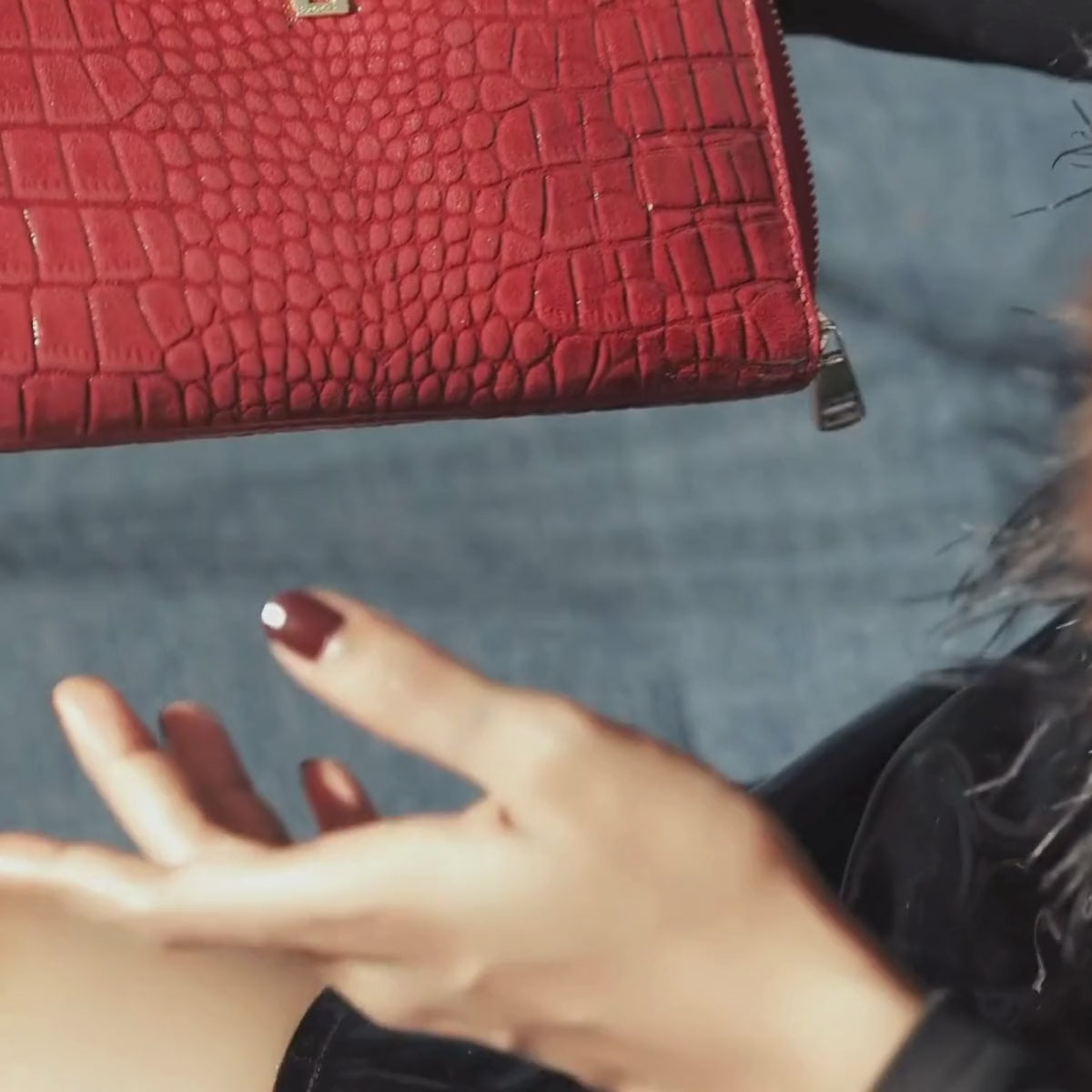 Lodis Amara Sling in Samba - Lifestyle Video Showing Hand Detail with Deep Red Glossy Croco-Embossed Leather Crossbody Bag | Lodis 1965