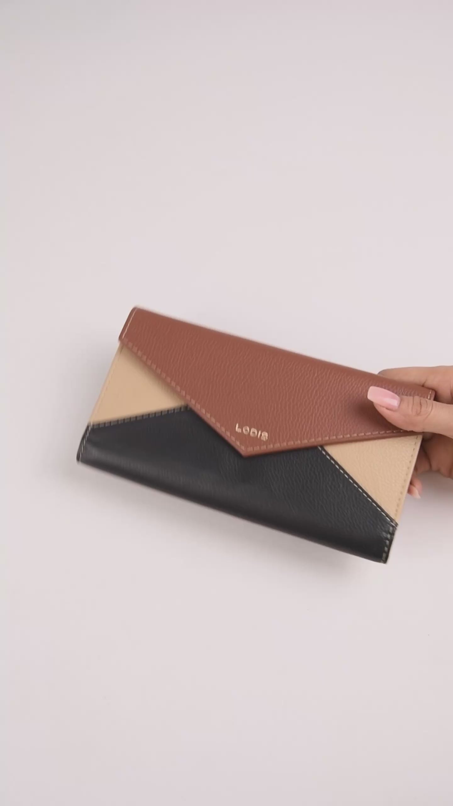 Vista Envelope Trifold Wallet in Black Chestnut Sand Pebbled Leather – Video Showing Full Exterior, Trifold Opening, and Patterned Interior Lining | Lodis 1965