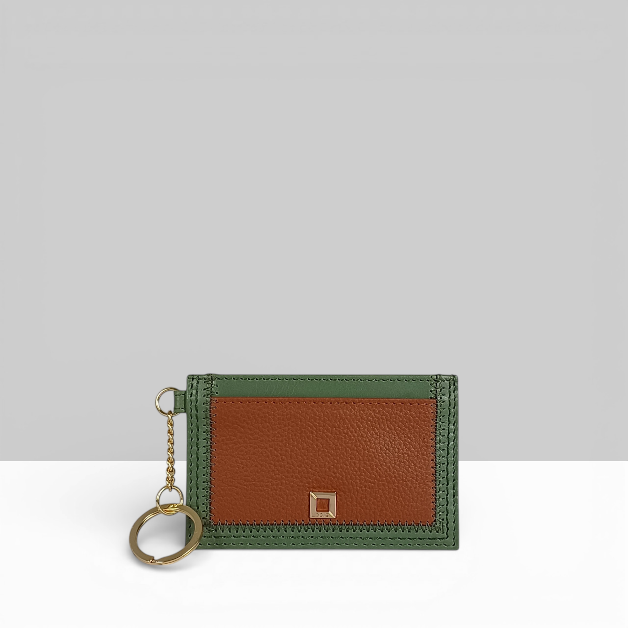 Cafe ID Card Case in Sage Green and Chestnut Two-Tone Leather – Front View with Gold Key Ring and Square Snap Closure | Lodis 1965